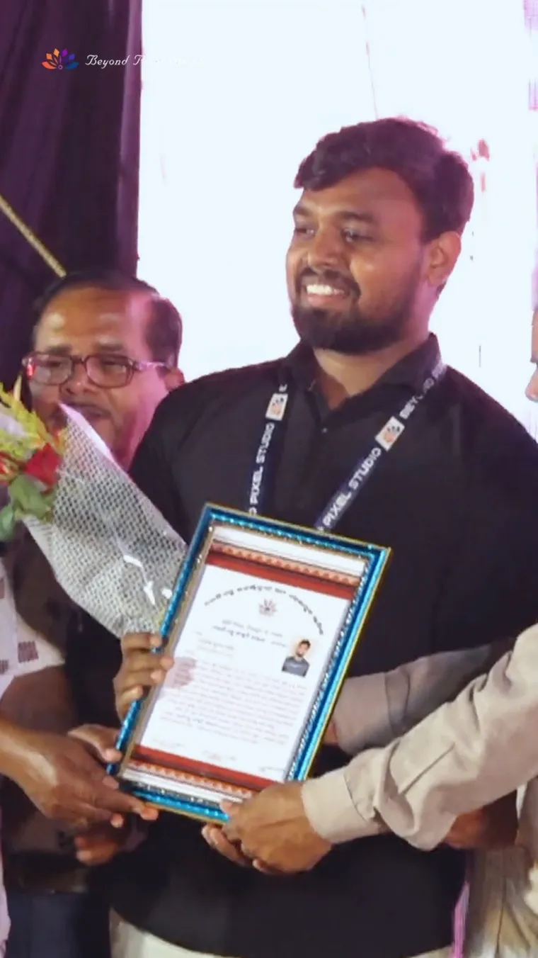 A framed certificate being presented to the studio at a felicitation ceremony