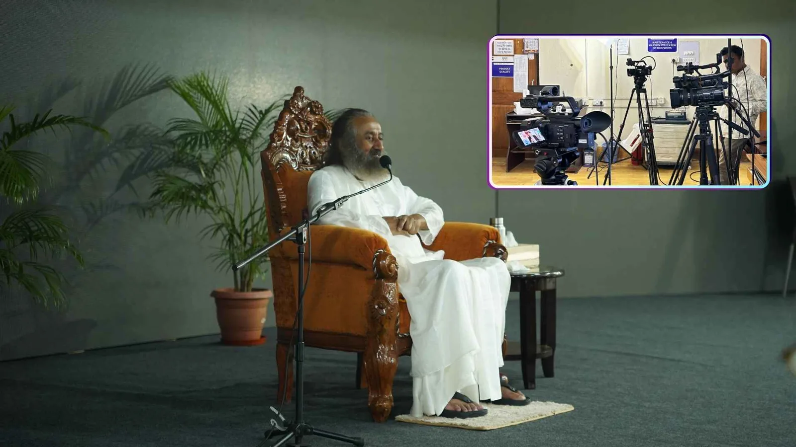 A seated speaker recording on a lit set with a boom microphone, with an inset frame showing the multi-camera rig covering it